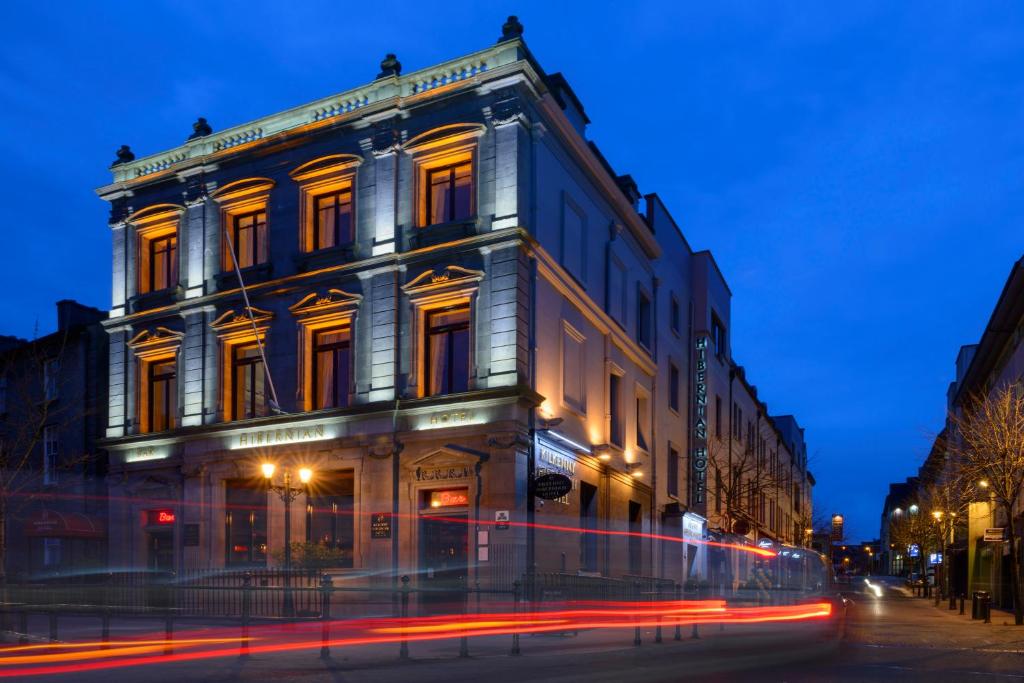 a building on a street at night with at Kilkenny Hibernian Hotel in Kilkenny