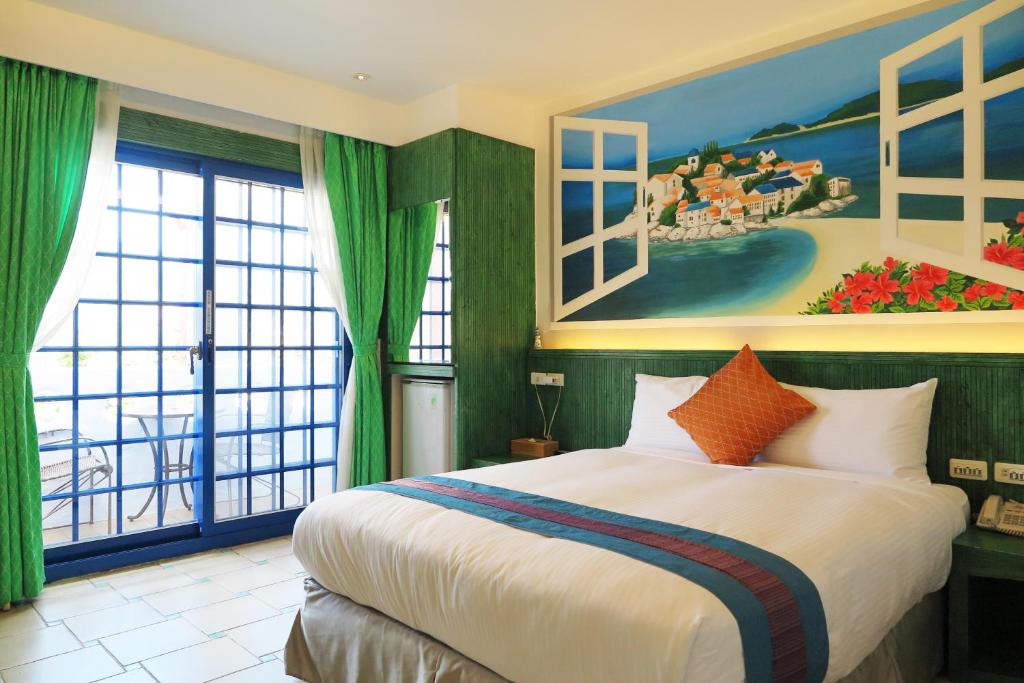 Tempat tidur dalam kamar di Kenting Sin Sin Hotel II