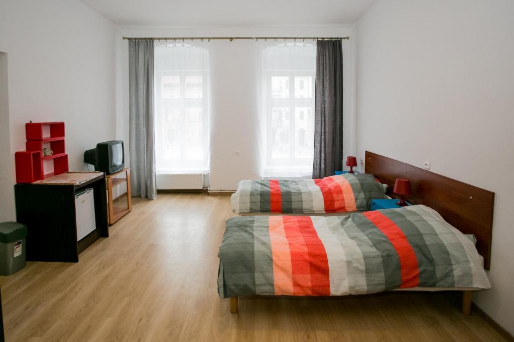 Ліжко або ліжка в номері Apartament na Starówce