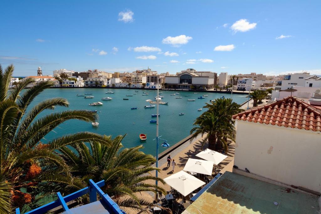 een uitzicht op een haven met boten in het water bij Top Charco San Gines Stunning View Lanzarote By PVL in Arrecife