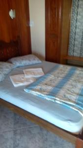 A bed or beds in a room at Pousada Da Restinga