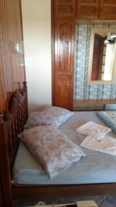 A bed or beds in a room at Pousada Da Restinga