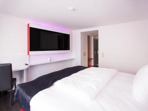 Postelja oz. postelje v sobi nastanitve DORMERO Hotel Villingen-Schwenningen