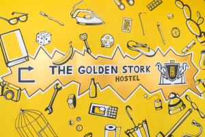 a collage of cartoon items on a yellow background at Hostel The Golden Stork in The Hague