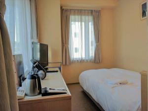 Giường trong phòng chung tại Hotel Harbour Yokosuka