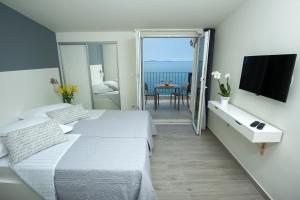 Letto o letti in una camera di Seaside Luxury Suites