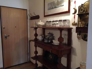 a room with a wooden shelf with items on it at Residence Redicervinia in Breuil-Cervinia