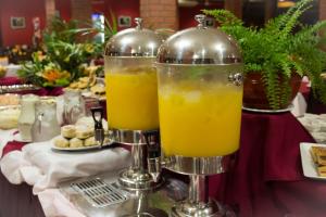 two glasses of orange juice sitting on a table at Hotel El Libertador in Puerto Iguazú