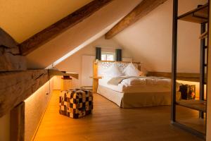 a bedroom with a bed in a attic at Boutique Hotel The River House in Andermatt