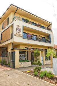 a building with a sign that reads mole breakfast at Pensiunea Nora Prestige in Timişoara