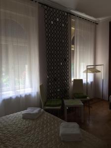 Giường trong phòng chung tại Rooms Portorose Center