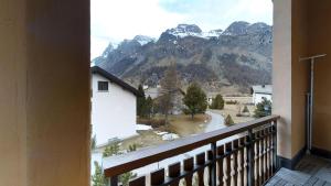 a balcony with a view of a mountain at Carla 12 in Sils Maria