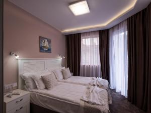 Krevet ili kreveti u jedinici u objektu Caro Apartments & Rooms