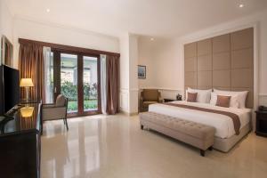 Voodi või voodid majutusasutuse Grand Palace Hotel Sanur - Bali toas