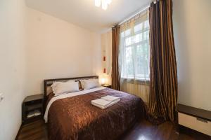 מיטה או מיטות בחדר ב-Partner Guest House Baseina