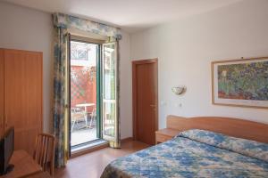 Кровать или кровати в номере Hotel Tirreno