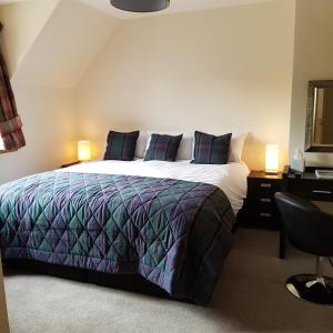 A bed or beds in a room at Kilmichael House