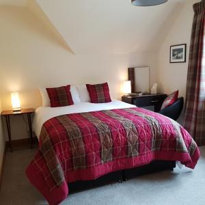 A bed or beds in a room at Kilmichael House