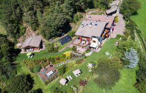 an aerial view of a house with a farm at Appartements Plattnerhof in Castelrotto