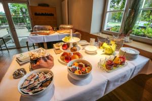 a table with many plates of food on it at Volkspark in Bamberg