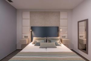 A bed or beds in a room at Silvi Villas by TAM Resorts