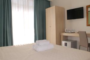 Voodi või voodid majutusasutuse Castello Boutique Rooms toas