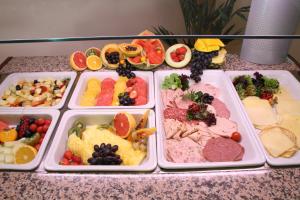 a tray filled with different types of food on a counter at Kurhotel Fürstenhof by David in Blankenburg