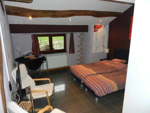 A bed or beds in a room at B&B Le 'Ti 'Bou de Refuge