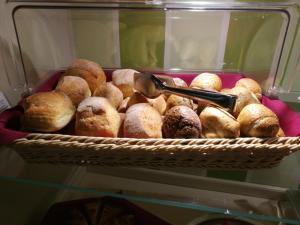 a basket full of pastries in a refrigerator at Hotel Borgo Antico in Como