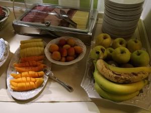 a bunch of fruits and vegetables on a table at Hotel Borgo Antico in Como