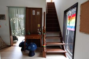 a staircase in a room with a rainbow stained glass window at Midorian in Nikko