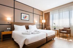 Кровать или кровати в номере Portus Cale Hotel