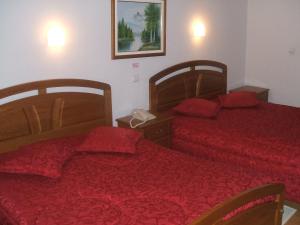 A bed or beds in a room at Residencial Pinto