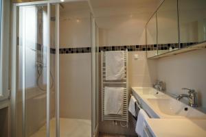 a bathroom with a shower and a sink at Chambre d hôte : Louvre Elegant Apt Suite in Paris