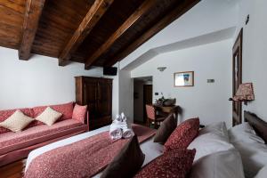 Una cama o camas en una habitación de Hotel Baita Cretaz