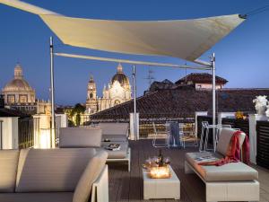 A seating area at Duomo Suites & Spa