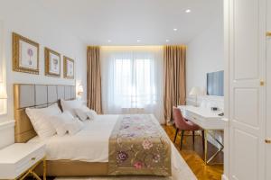 Ann Luxury Rooms tesisinde bir odada yatak veya yataklar