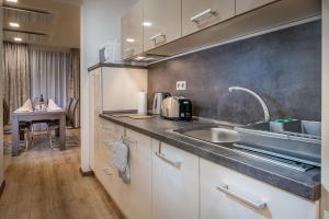 Кухня или кухненски бокс в Apartmánový Dom Kriváň