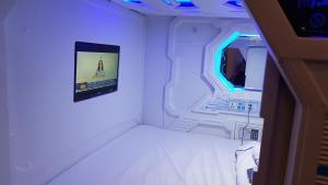 A television and/or entertainment centre at Galaxy Pods @ Chinatown