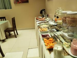 a buffet line with many different types of food at UTASA VILLA REAL inn in Puno