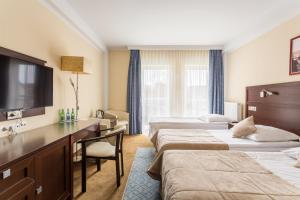 Krevet ili kreveti u jedinici u objektu Hotel Aurora Family & SPA