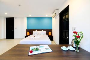 Giường trong phòng chung tại Hoi An Dream City Hotel