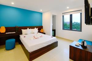 Giường trong phòng chung tại Hoi An Dream City Hotel