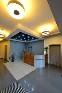 a lobby with a reception desk in a building at Nova Stodola in Kłomnice