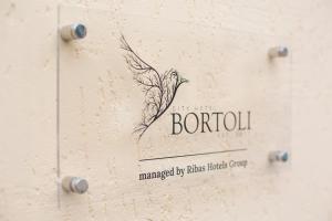 a drawing of a feather on the side of a box at City Hotel Bortoli by Ribas in Odesa