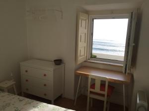 A bed or beds in a room at Seafront house above the beach M113