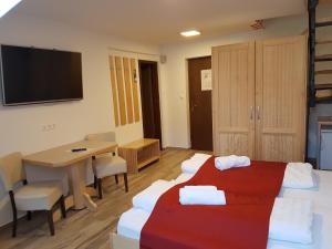 Ліжко або ліжка в номері Hotel Gasperin Bohinj