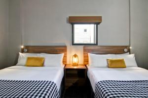 A bed or beds in a room at Canalta Lodge