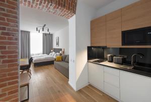 Una cocina o kitchenette en Aparthotel BC 29 Residence