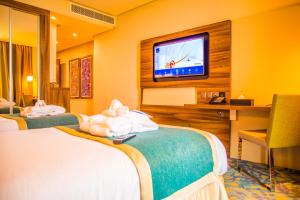 Ένα ή περισσότερα κρεβάτια σε δωμάτιο στο Novotel Yanbu Albahr